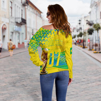 Women’s off-shoulder Brazil sweater, yellow with green geometric back graphic