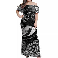 Black off-shoulder maxi dress with large fish motif and ornate tropical pattern