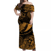 Gold-and-black off-shoulder long dress with large fish motif and ornate scroll print