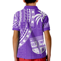 Kids purple polo shirt back with 7s lettering, crest shield, and patterned icons