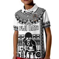 Kids rugby polo with white base, black tribal pattern, "FIJI BATI" and kneeling figure