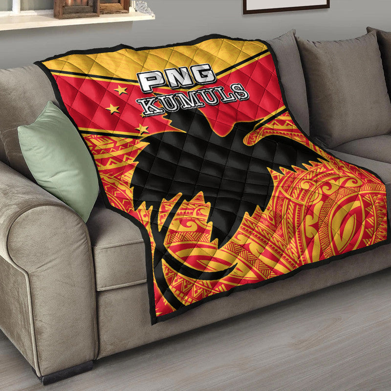 Premium quilt with red, black, and yellow diamond quilting and PNG Kumuls logo patch