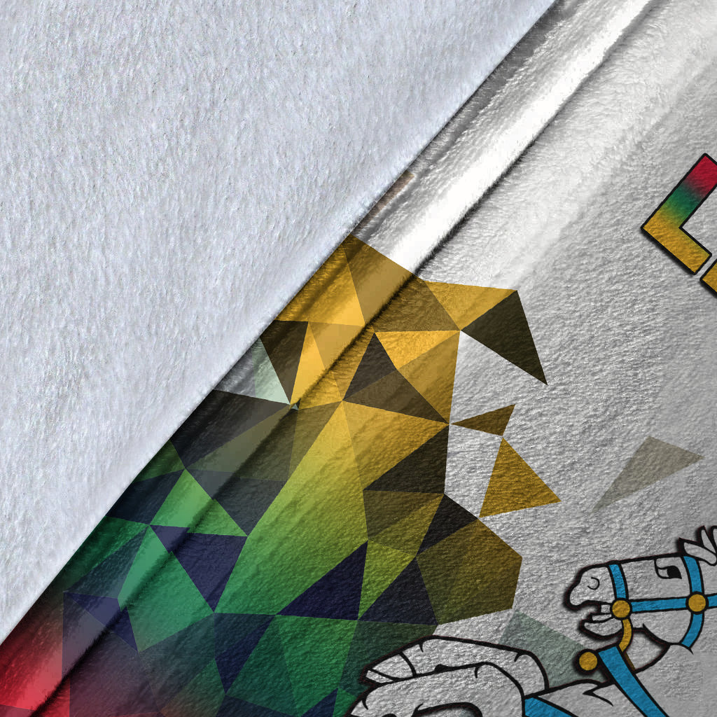 Lithuania blanket fabric close-up: white with gold-green-blue triangles and knight graphic
