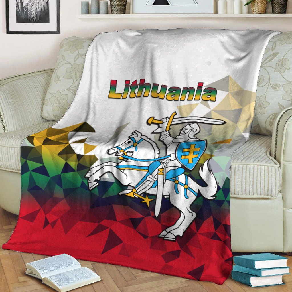 Lithuania white blanket showing knight in blue with shield, over red-and-green triangles
