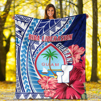 Blue Guam Biba Liberasion blanket draped outdoors, bold hibiscus and palm graphic