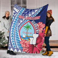 Large Guam Biba Liberasion blanket with blue geometric border, hibiscus and palm