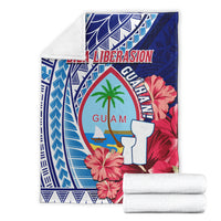 Guam Biba Liberasion blanket folded, blue and red hibiscus with palm-tree emblem