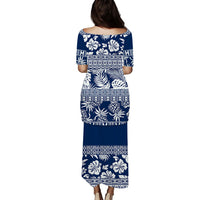 Blue long off-shoulder dress with white tropical floral leaf print and patterned yoke