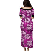 Pink long hibiscus print maxi dress with purple tapa pattern and black-trimmed sleeves
