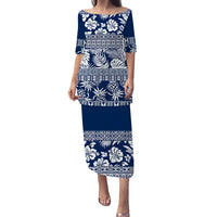 Blue long off-shoulder dress with white floral leaf and geometric tropical bands