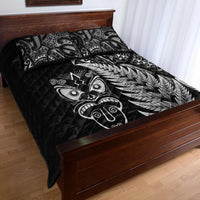 Black quilt bed set with silver fern and Maori mask motifs on quilted comforter