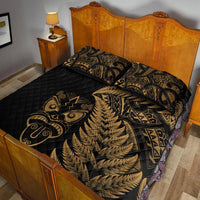 Black quilt bed set with gold fern and Maori pattern; pillow and bed cover shown