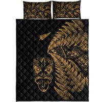 Set view: black quilt and 2 pillows with gold fern, tribal mask, and patterned motifs