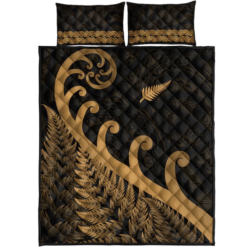 Black duvet cover with gold koru scroll, fern leaf pattern, and two matching pillowcases