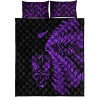Front view: black quilt with purple fern and tribal face, two purple-pattern pillowcases