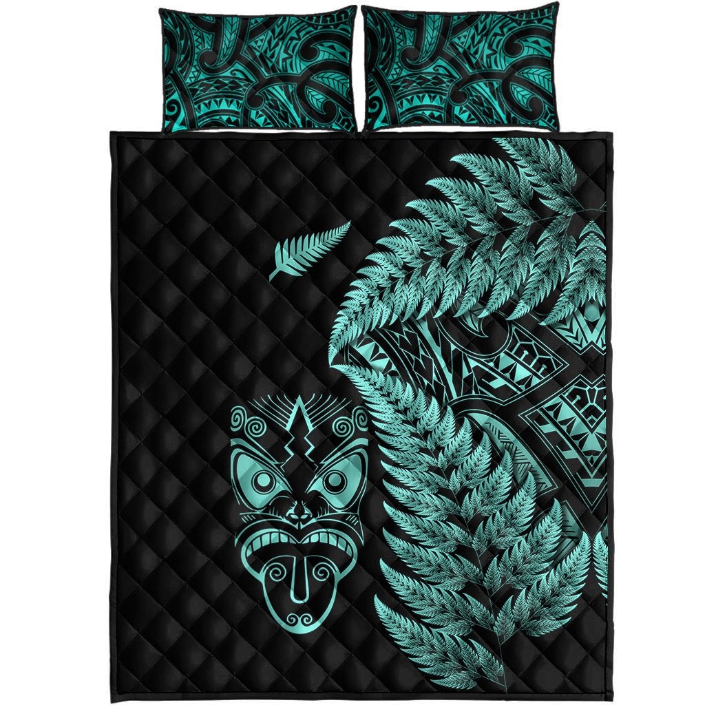 Black comforter set with turquoise fern fronds, Maori mask art, and two matching pillows
