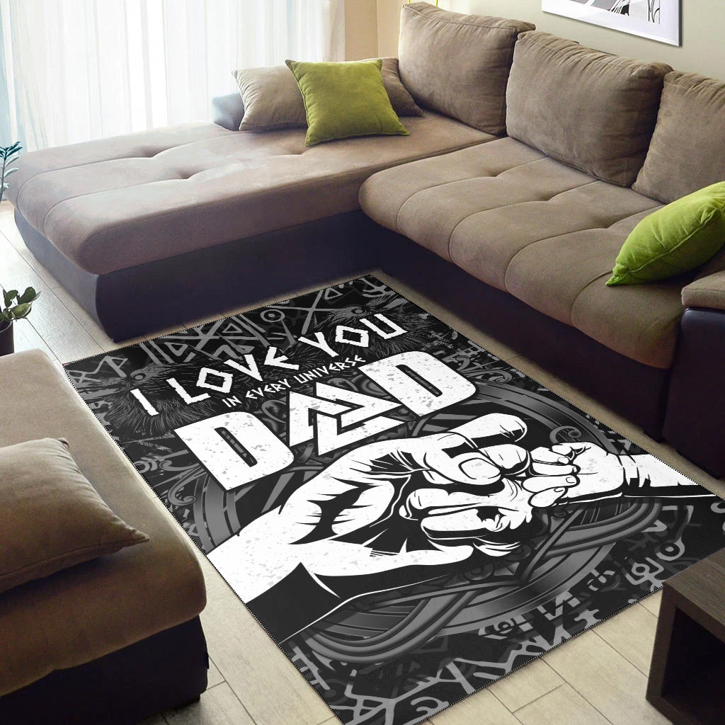 Black rug on floor with bold white Viking text, runes, and hammer artwork