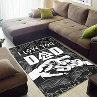 Black rug on floor with bold white Viking text, runes, and hammer artwork