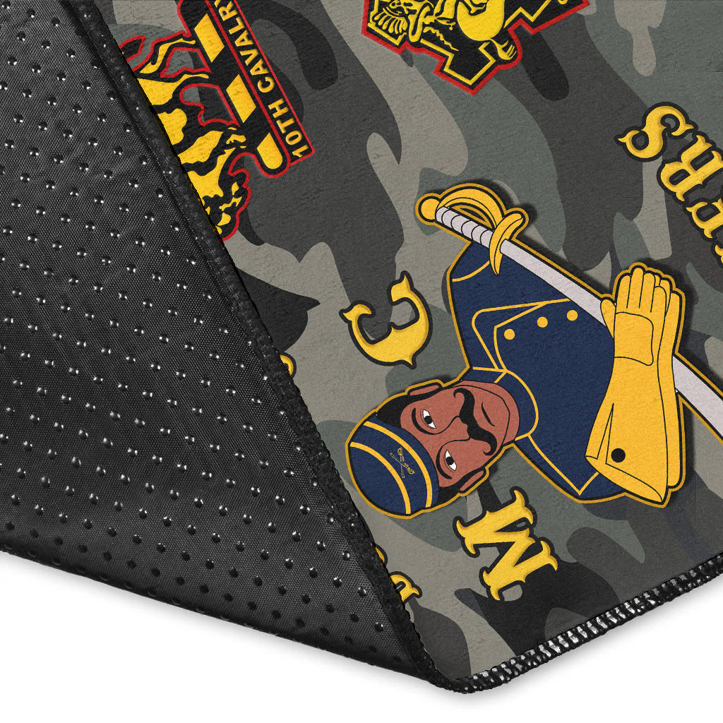 Close-up of camouflage rug corner with black textured edging and “Buffalo Soldiers” design