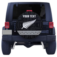 Black circular spare tire cover with white fern design and ornate swirls, 'YOUR TEXT'