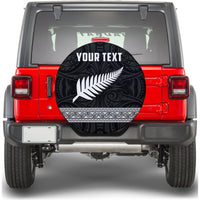 Black spare tire cover with white fern motif and decorative swirls, 'YOUR TEXT' text