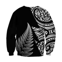 Black rugby sweatshirt with large feather graphic and Maori-style half-sleeve pattern