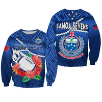 Blue rugby sweatshirt with hibiscus floral, football graphic, and Manu Samoa text