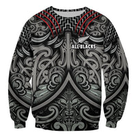 Black rugby sweatshirt with Maori-inspired pattern and central “All Blacks” graphic