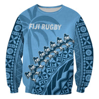 Blue unisex rugby sweatshirt with FIJI RUGBY text and tapa-inspired geometric print