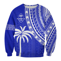 Blue crewneck sweatshirt with white tribal patterns, palm tree graphic, and circular logo