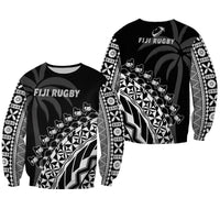 Black rugby sweatshirt with white tribal tiki pattern and long sleeves, crew neck