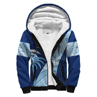 Blue sherpa-lined zip hoodie with hood, tribal pattern sleeves and black trim