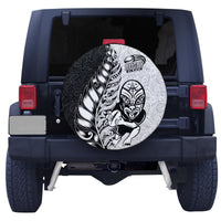 Spare tire cover with centered circular Maori rugby face-and-feather graphic