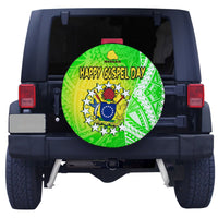 Green patterned spare tire cover with “Happy Gospel Day” text and badge emblem