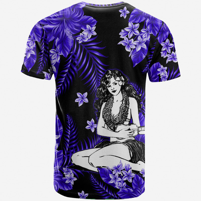 Hula girl graphic T-shirt with centered seated woman, purple hibiscus flowers on dark blue/black