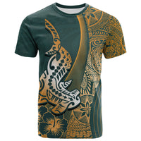 Green crewneck T-shirt with gold Polynesian shark and floral graphic