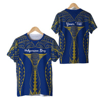 Blue Polynesian Day T-shirt, gold tribal print; front and back views on hanger