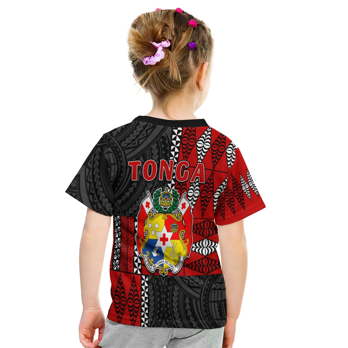 Kid Tonga tee back view: red/black tribal print with crest and TONGA text