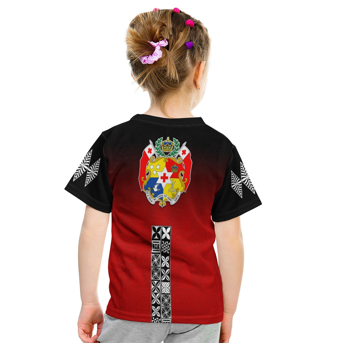 Kids red T-shirt back view with crest and vertical Tongan tapa pattern on black