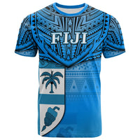 Blue Fiji graphic T-shirt with tribal pattern, palm, shell, and geometric motifs