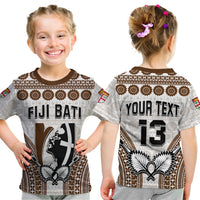 Kids rugby-style T-shirt shown front and back, with 'FIJI BATI' and 'YOUR TEXT 13' prints.