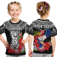 Kids black graphic t-shirt with CHAMORRO and floral Guam design