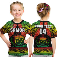 Kids rugby polo shirt in black with Samoa graphic, green/red/yellow patterns and logo text
