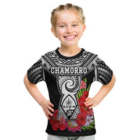 Kids black graphic t-shirt with CHAMORRO crest and red flower border