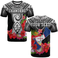 Black T-shirt with CHAMORRO graphic, Guam shield, tropical flowers and leaves