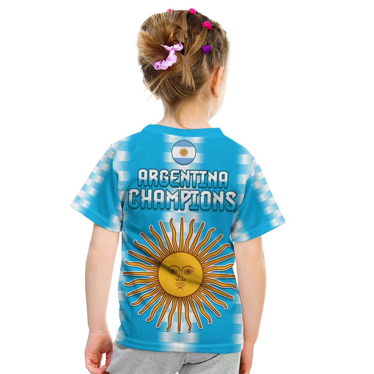Blue football t-shirt with 'Argentina Champions' text and sun face emblem on back