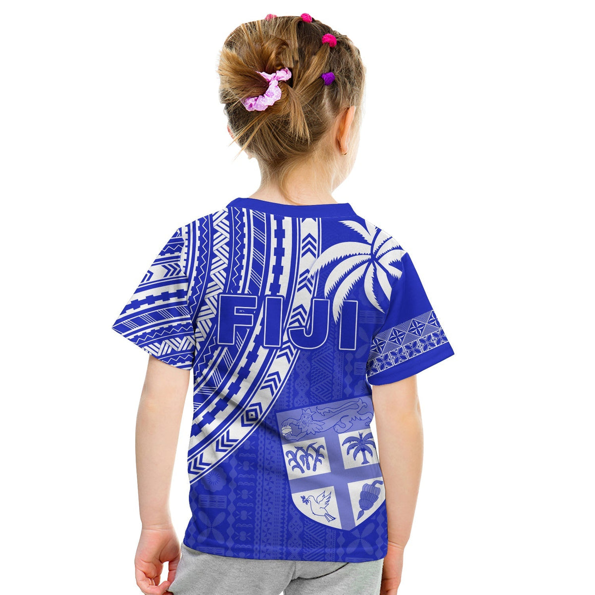 Kids blue rugby sevens T-shirt with geometric patterns and crest graphic, back view