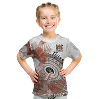 Kids white T-shirt with brown floral print, FIJIAN text and crest emblem front