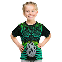 Kids green T-shirt with black neck, fern and hei tiki graphic on front