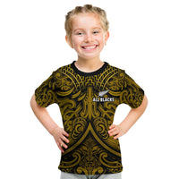 Kids rugby T-shirt, black with gold Maori swirl graphic and All Blacks chest logo
